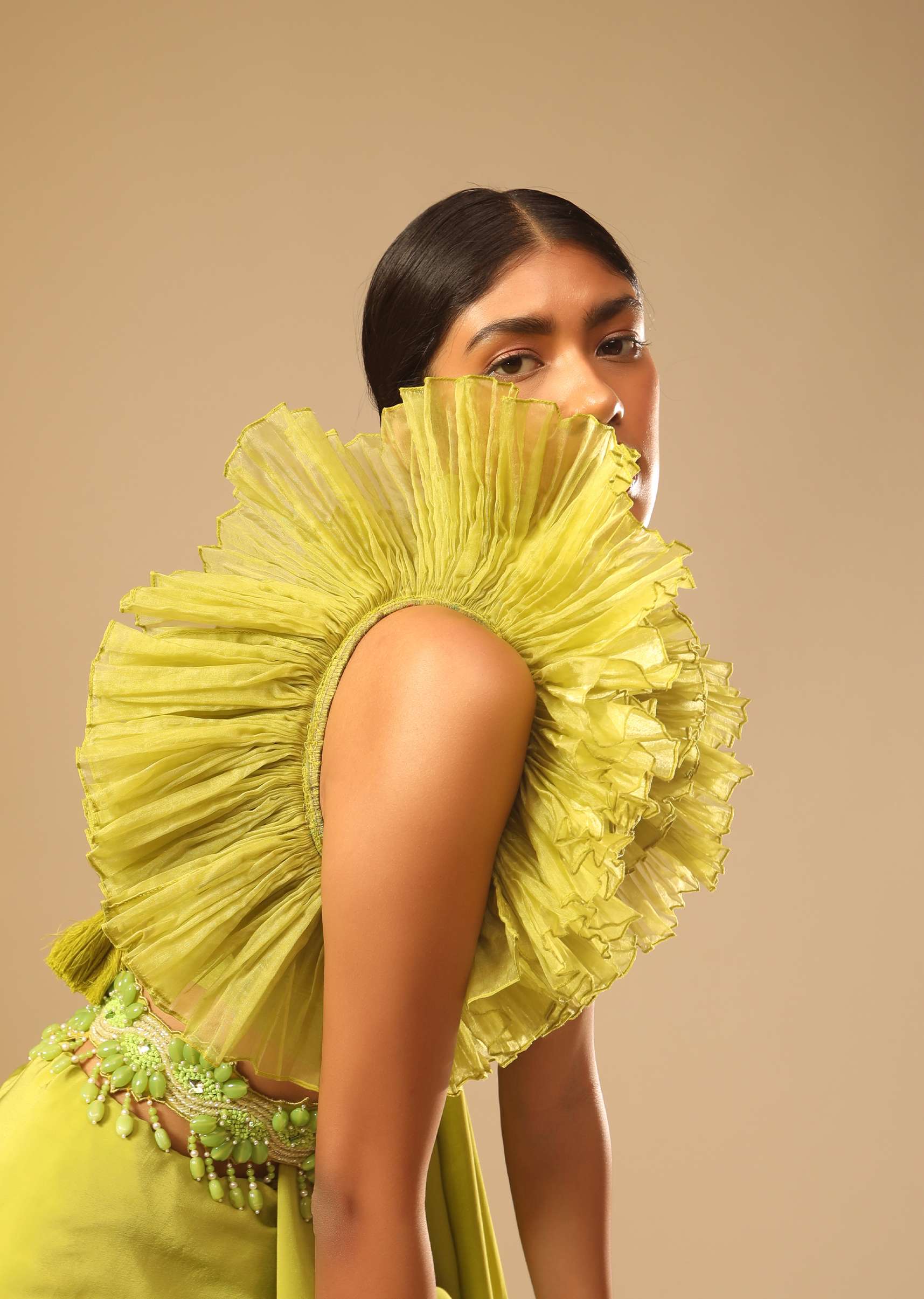 Lime green georgette saree with ruffle sleeves and embroidered belt