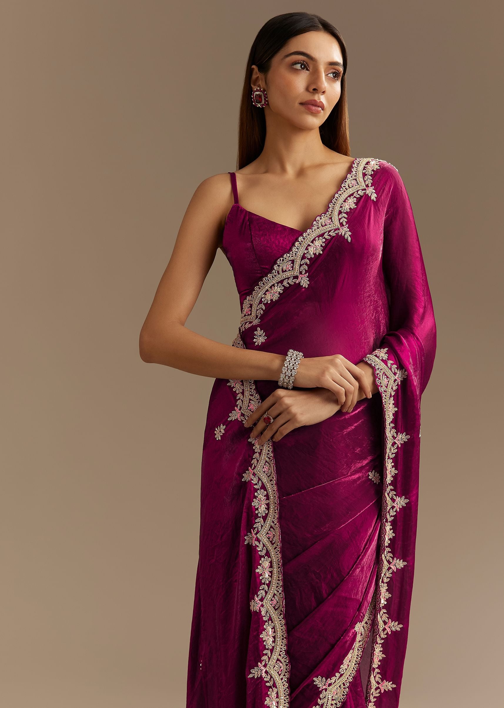 Purple gajji satin zardosi embroidered blouse paired with pleated skirt with border and organza dupatta
