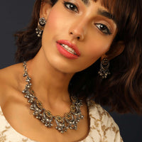 Gold And Silver Toned Tribal Necklace With Floral Motifs And Ghunghroo