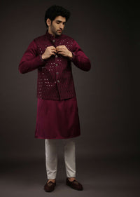 Wine Nehru Jacket Set In Raw Silk With Resham And Mirror Embroidered Geometric Jaal And Aligarh Pants