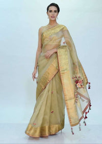 Golden beige organza saree with brocade border only on Kalki