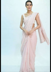 Pale pink georgette saree with self floral embroidery and butti only on kalki