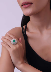 92.5 Sterling Silver Ring Studded With Lab Diamonds And A Round Emerald Green Stone