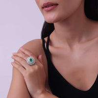 92.5 Sterling Silver Ring Studded With Lab Diamonds And A Round Emerald Green Stone