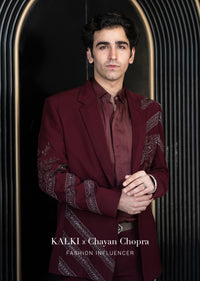 Deep Wine Self Embroidered Tuxedo With Geometric Motifs