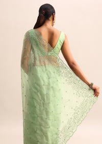 Green Organza Saree With Floral Thread Work Border And Unstitched Blouse