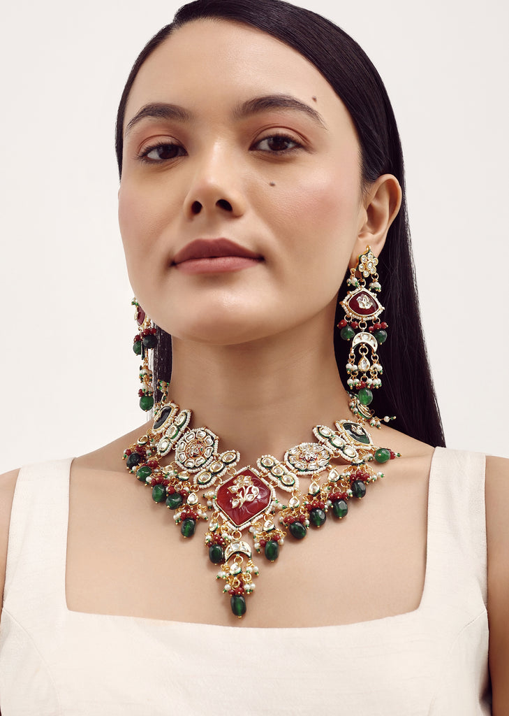 Gold Finish Kundan Necklace Set With Ruby And Emerald In Mix Metal