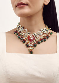 Gold Finish Kundan Necklace Set With Ruby And Emerald In Mix Metal