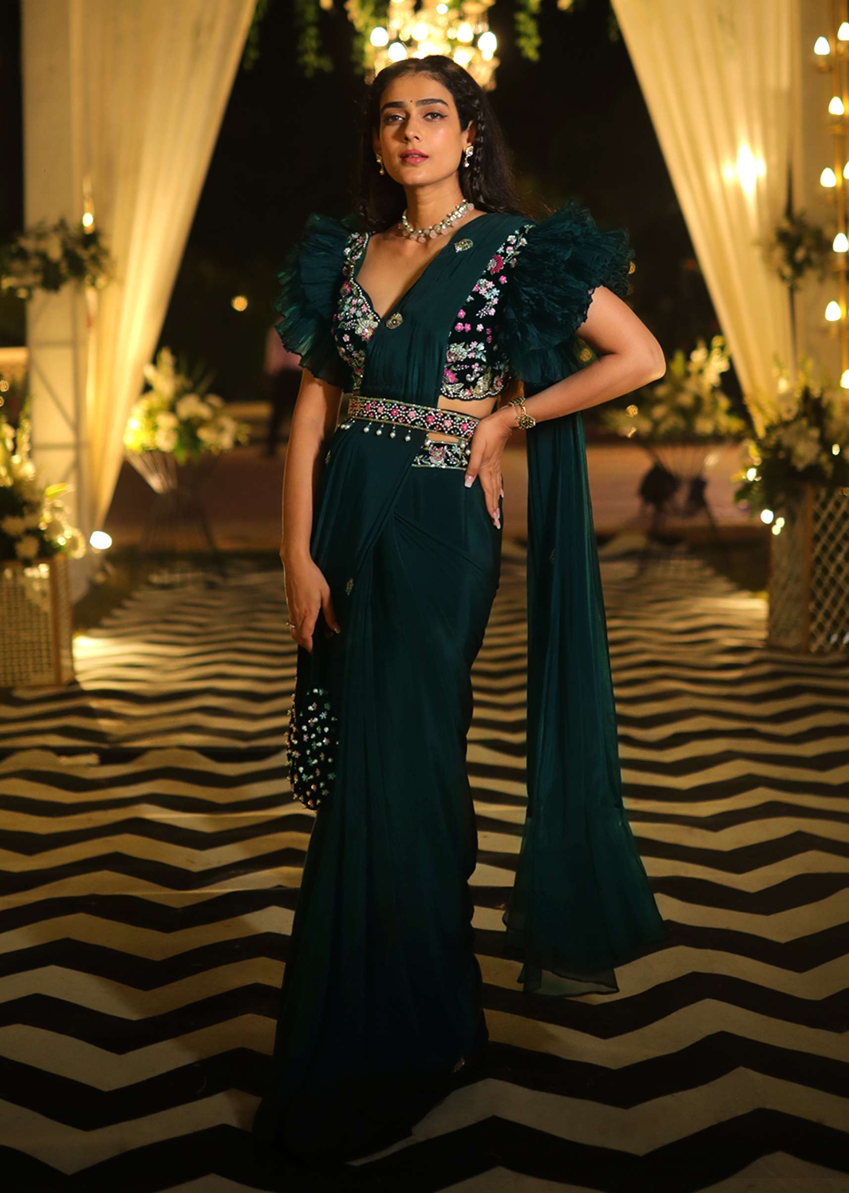 Bottle Green Ready Pleated Saree With A Colorful Hand Embroidered Blouse With Fancy Layered Frill Sleeves