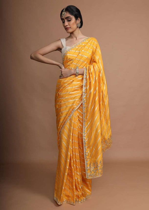 Amber Yellow Saree In Silk With Gotta Work Stripes And Gotta Patti Embroidered Leaf Motifs On The Border Online - Kalki Fashion