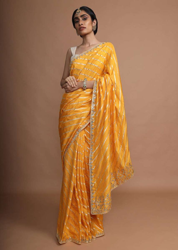 Amber Yellow Saree In Silk With Gotta Work Stripes And Gotta Patti Embroidered Leaf Motifs On The Border Online - Kalki Fashion