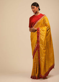 Amber Yellow Saree In Silk With Lurex Woven Chevron Design And Red Bandhani Border Along With Unstitched Blouse