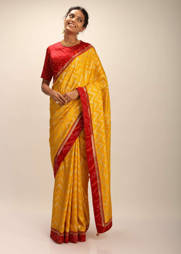 Amber Yellow Saree In Silk With Lurex Woven Chevron Design And Red Bandhani Border Along With Unstitched Blouse