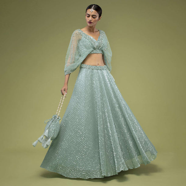 Angel Blue Lehenga And Crop Top Set With Drape On The Shoulder, Lehenga Is Crafted In Shimmer Crush With Sequins Embroidery