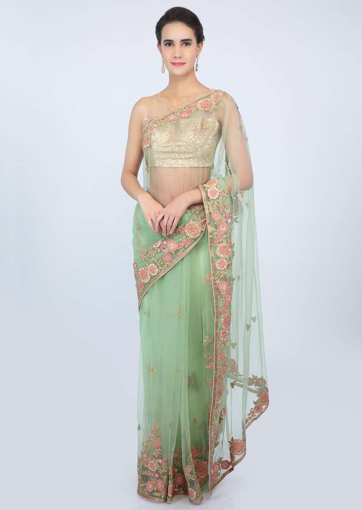 Apple green sheer net saree with floral  embroidered butti and border only on kalki