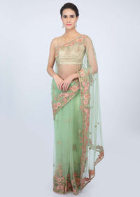 Apple green sheer net saree with floral  embroidered butti and border only on kalki