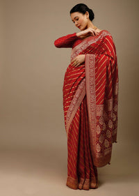 Apple Red Saree In Silk With Diagonal Stripes And Red Brocade Bandhani Pallu And Border Along With Unstitched Blouse