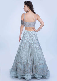 Aqua Blue Lehenga In Heavy Embroidered Net With Multi Layer Net Pleating At The Hem Online - Kalki Fashion