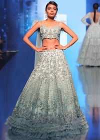 Aqua Blue Lehenga In Heavy Embroidered Net With Multi Layer Net Pleating At The Hem Online - Kalki Fashion