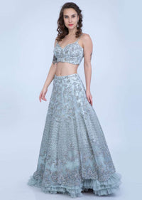 Aqua Blue Lehenga In Heavy Embroidered Net With Multi Layer Net Pleating At The Hem Online - Kalki Fashion