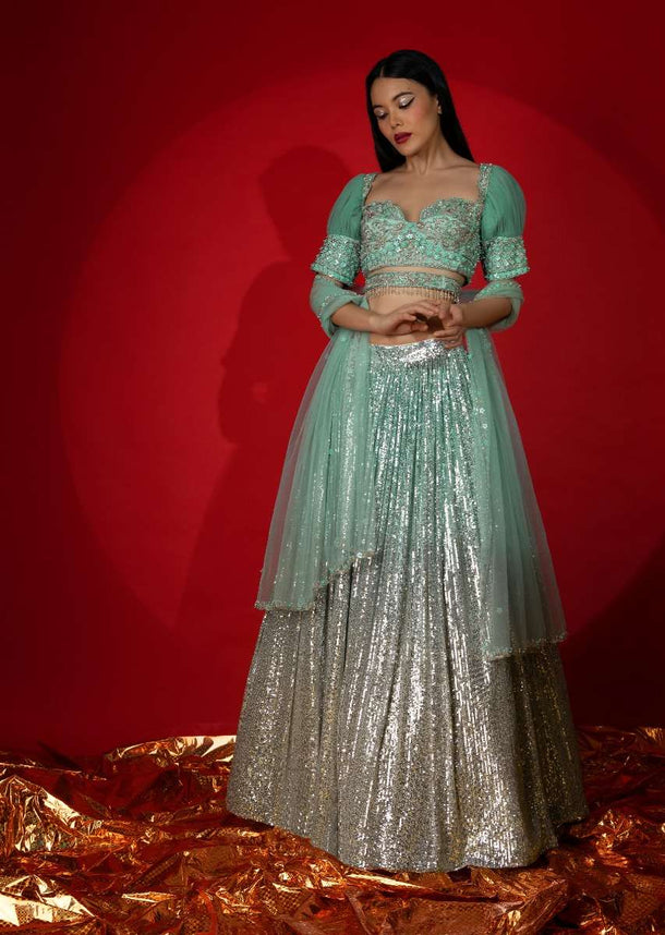 Aqua Green Ombre Sequins Lehenga With Hand Embroidered Choli Featuring Half Puffed Sleeves