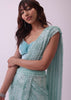 Aqua Blue Saree And Stitched Velvet Blouse With Hanging Crystals