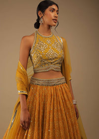 Arrowwood Yellow And Red Lehenga With A Crop Top In Digital Bandhani Print, Choli Comes In Multiple Tones Of Cut Dana And White Moti Embroidery Buttis