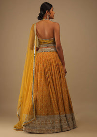 Arrowwood Yellow And Red Lehenga With A Crop Top In Digital Bandhani Print, Choli Comes In Multiple Tones Of Cut Dana And White Moti Embroidery Buttis