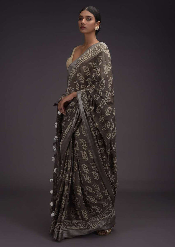 Ash Grey Saree In Linen With Batik Printed Buttis And Zari Weaved Border Online - Kalki Fashion