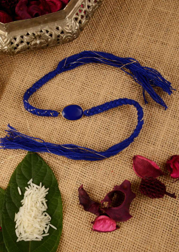 Azure Blue Braided Rakhi Enhanced In Semi-Precious Coloured Stone