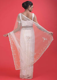 Baby Pink Saree In Net With Floral Buttis In Sequins And A Sequins Embellished Blouse Online - Kalki Fashion