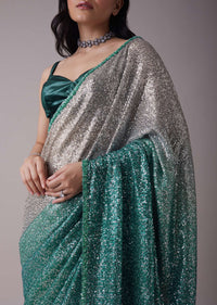 Sea Green And Silver Toned Sequins Saree With An Embellished Border