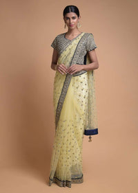 Banana Yellow Saree In Net With Sequins Buttis And Navy Blue Blouse In Velvet Online - Kalki Fashion