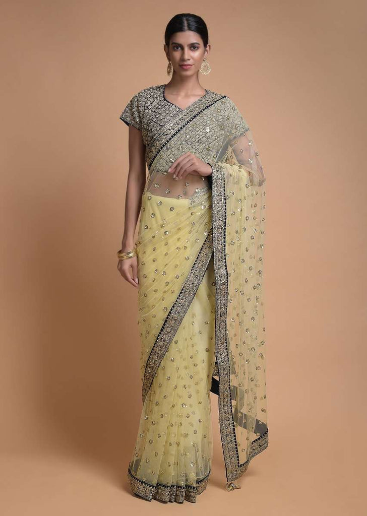 Banana Yellow Saree In Net With Sequins Buttis And Navy Blue Blouse In Velvet Online - Kalki Fashion