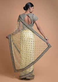 Banana Yellow Saree In Net With Sequins Buttis And Navy Blue Blouse In Velvet Online - Kalki Fashion