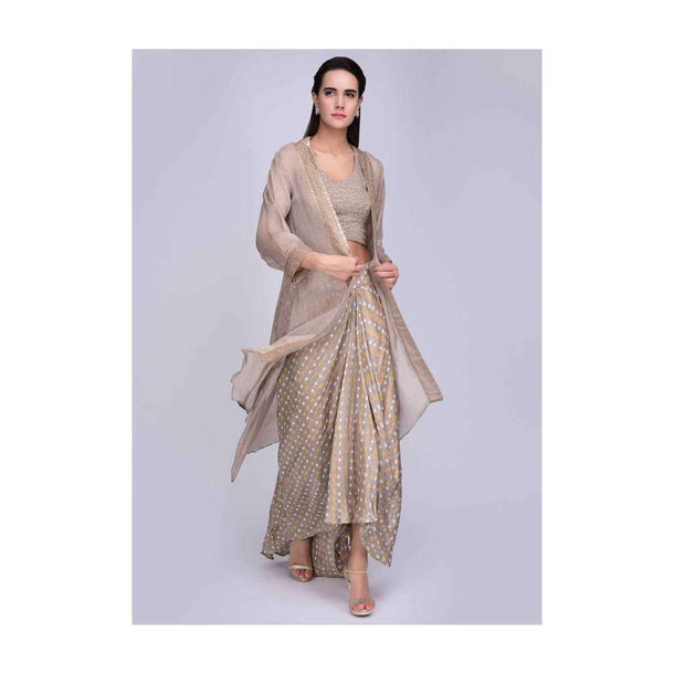 Beige crop top and jacket with a front short back long fancy draped skirt only on Kalki