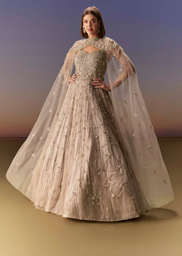 Beige Gown With Shoulder Cape And Rich Vertical Embroidery