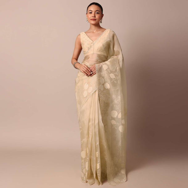 Beige Organza Silk Saree With Appliqué Work And Unstitched Blouse Fabric