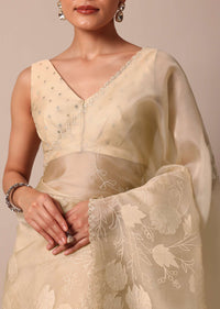 Beige Organza Silk Saree With Appliqué Work And Unstitched Blouse Fabric