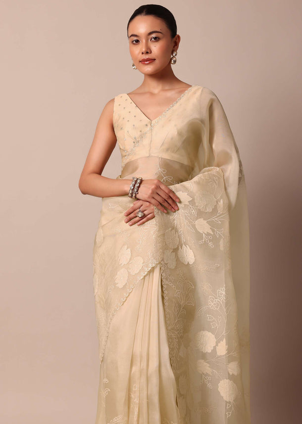 Beige Organza Silk Saree With Appliqué Work And Unstitched Blouse Fabric