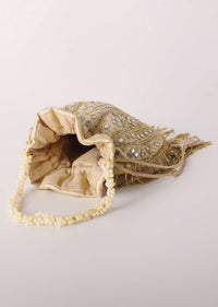 Beige Potli In Satin With Hand Embroidery Detailing Using Mirror And Cut Dana Fringes