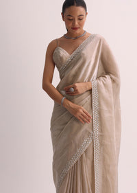 Beige Saree With Cutdana Border And Unstitched Blouse