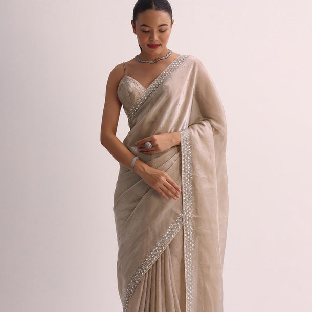 Beige Saree With Cutdana Border And Unstitched Blouse