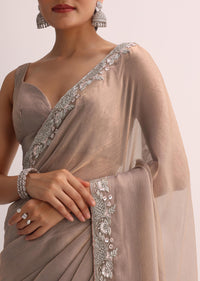 Beige Saree With Embroidered Border And Unstitched Blouse