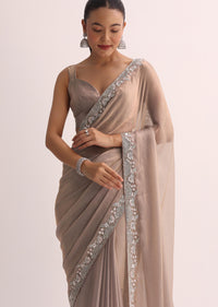 Beige Saree With Embroidered Border And Unstitched Blouse
