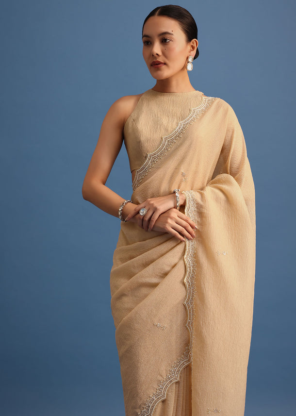 Beige Tissue Saree With Moti And Cutdana Border And Unstitched Blouse