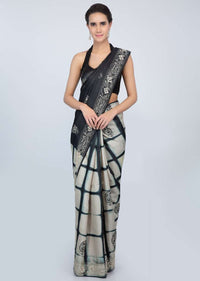 Black and cream shaded half and half tussar silk saree in batik print and thread embroidery only on kalki