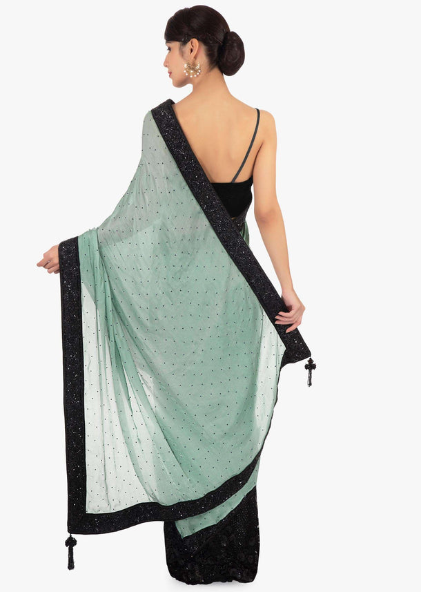 Black and green half and half saree in net and chiffon satin