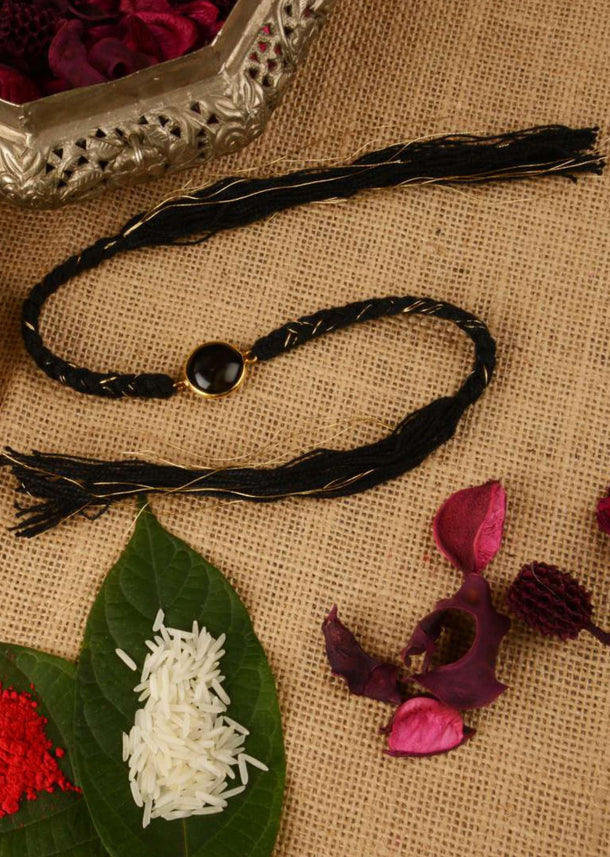 Black Braided Rakhi In Gold And Black Thread Work Is Further Enhanced In Semi-Precious Stone