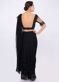 Black georgette draped saree with net embroidered blouse only on kalki